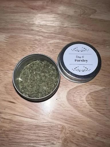 A labeled scent tin used for Early Scent Introduction — Day 6, Parsley